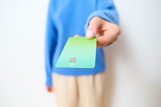 employee holding NFC card